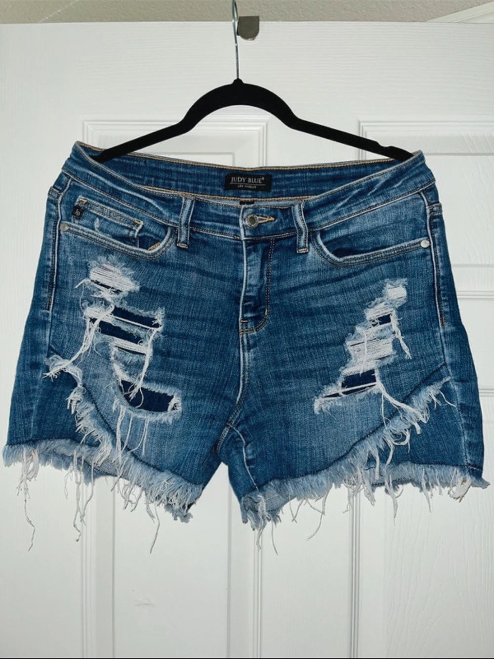 Judy Blue Distressed Tulip Hem Mid-Rise Denim Shorts - Blue Wash